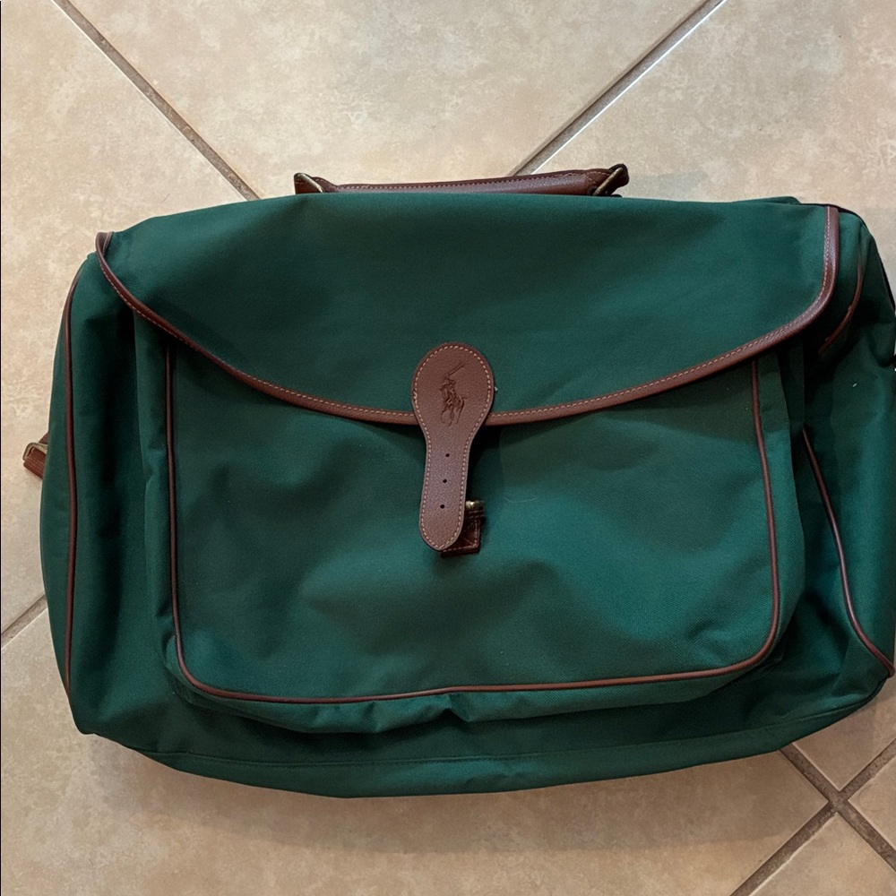vintage Polo Ralph Lauren green canvas duffel bag with brown leather trim.